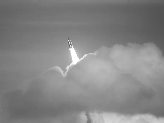 low-angle photography of red space shuttle